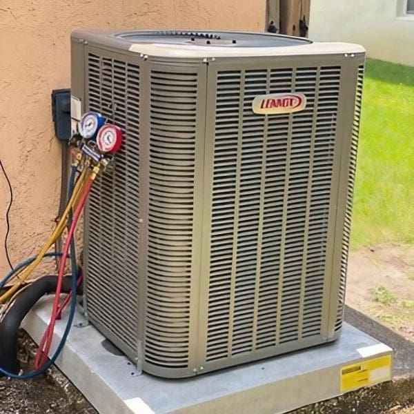 Installed Air Conditioner Unit Outside A residential air conditioning unit is installed outside, providing cooling to the building or home