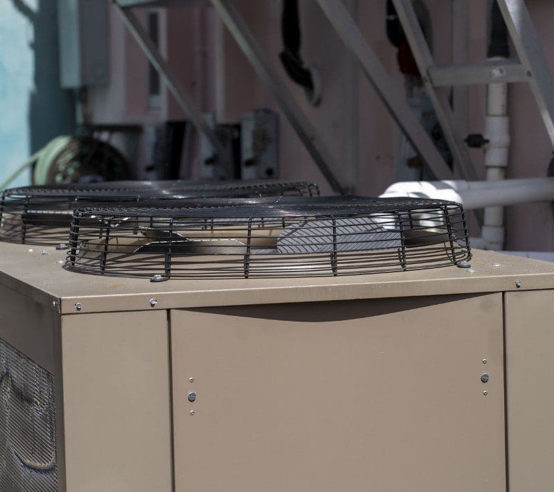 Air Conditioning Unit Installed on a Roof Top An air conditioning unit installed on a rooftop, providing cooling for the building below