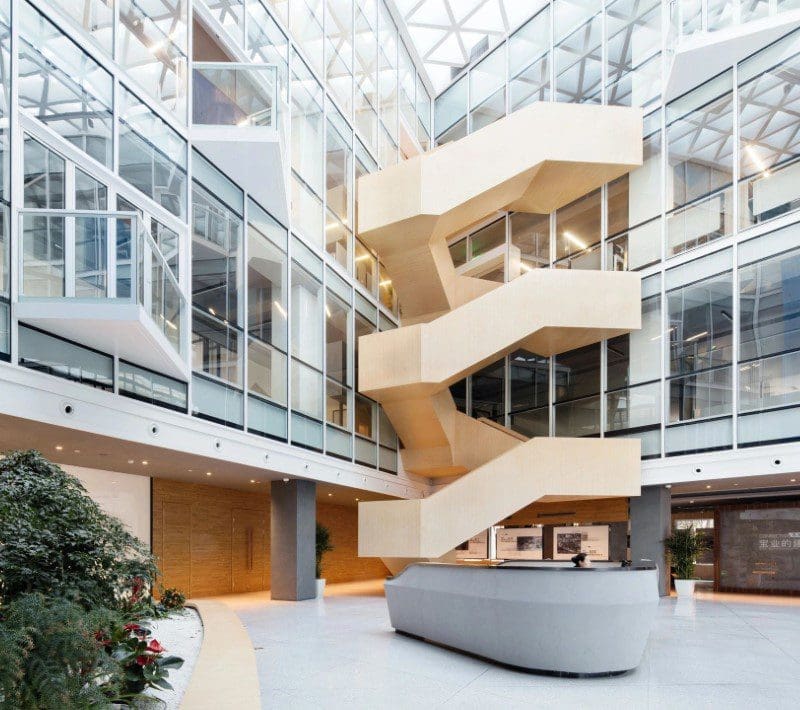 A large atrium with stairs and glass walls.