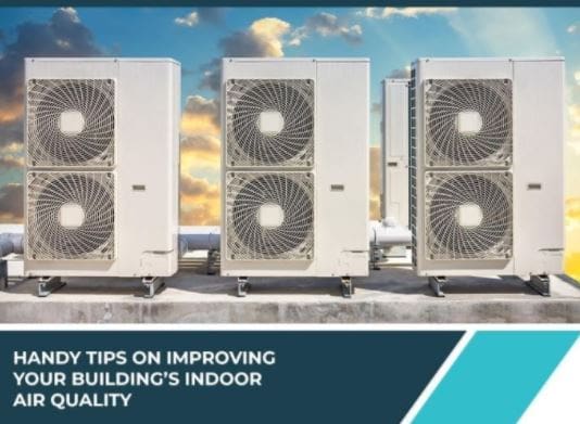 Three Air Conditioners on a Building's Roof Three air conditioning units are positioned on the roof of a building, providing cooling for the structure from an elevated location