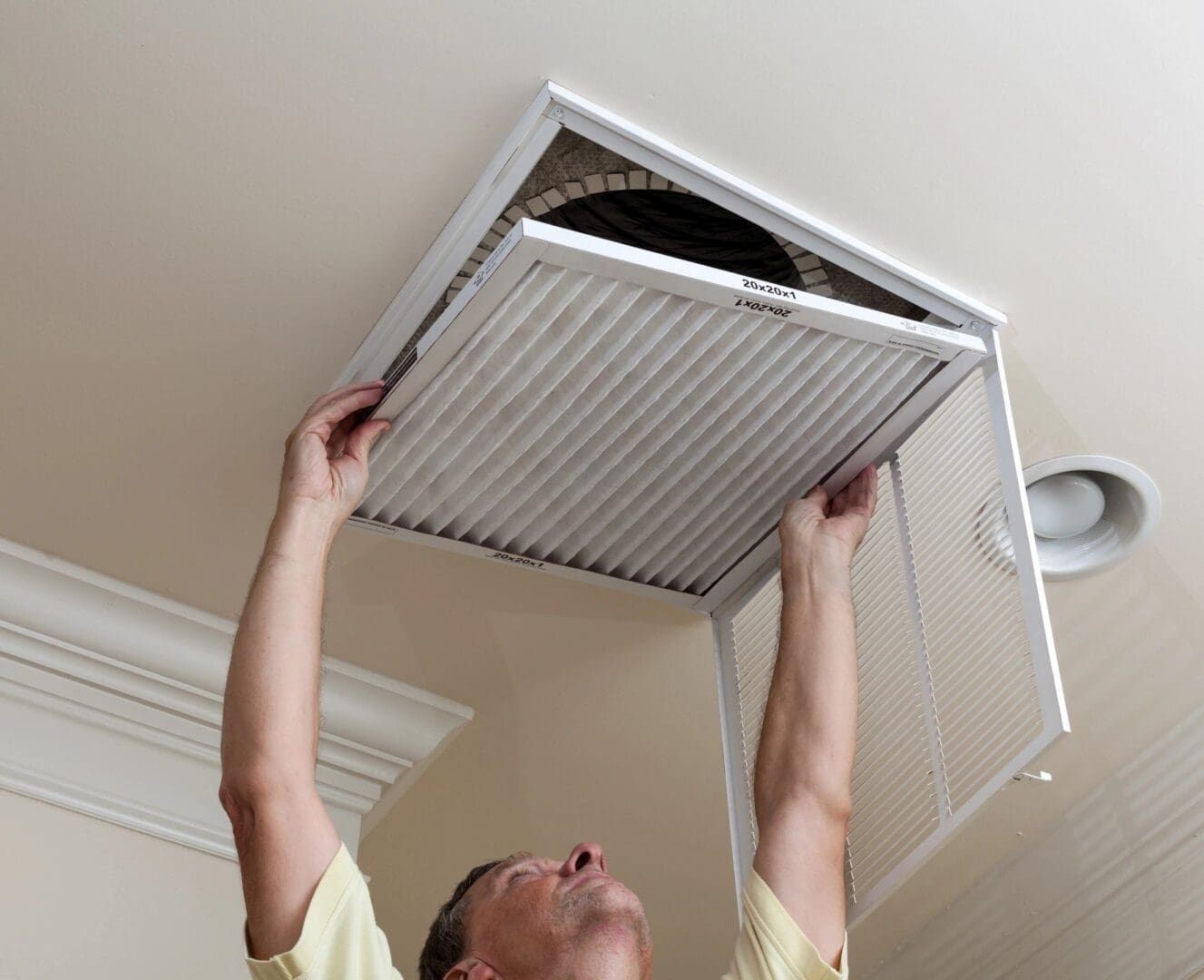 AC Air Filter Replaement Air Conditioning filter replaced in a ceiling register by a homeowner