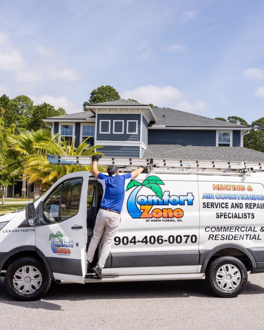 air conditioning company van in Yulee, FL Air Conditioning Service technician removing a ladder from the work van