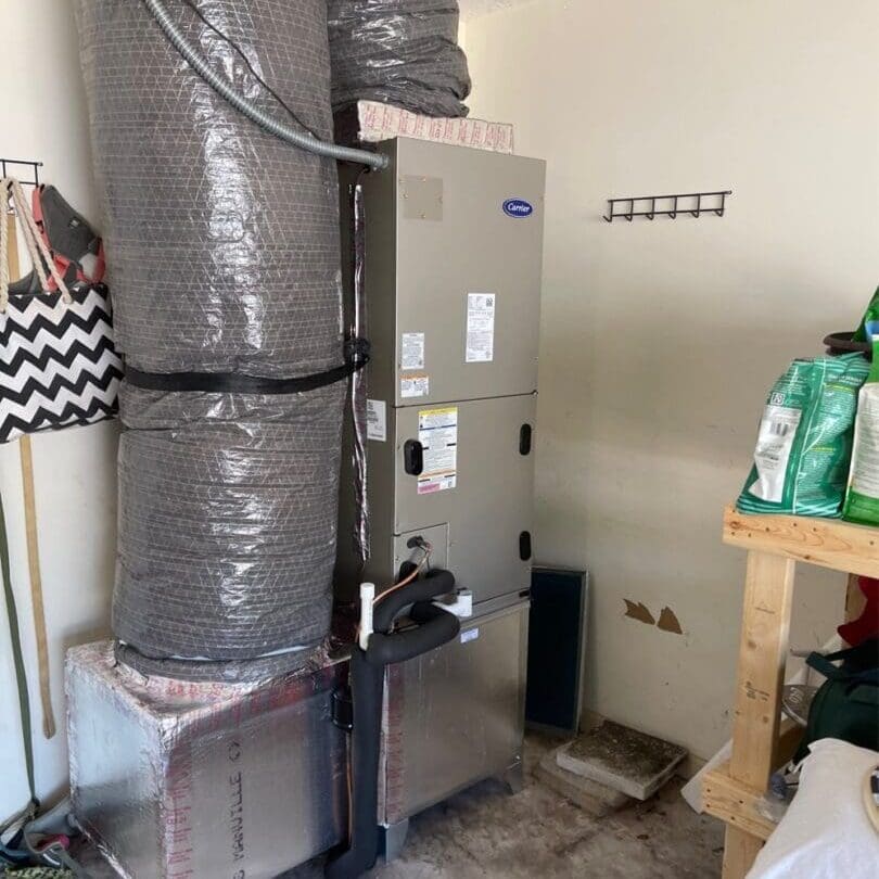 Air Conditioner Installed in a Garage An air conditioning unit is installed in a garage, mounted securely and positioned for efficient operation in the space.