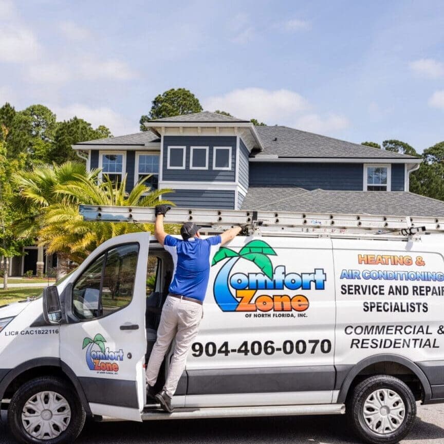 air conditioning company van in Yulee, FL Air Conditioning Service technician removing a ladder from the work van