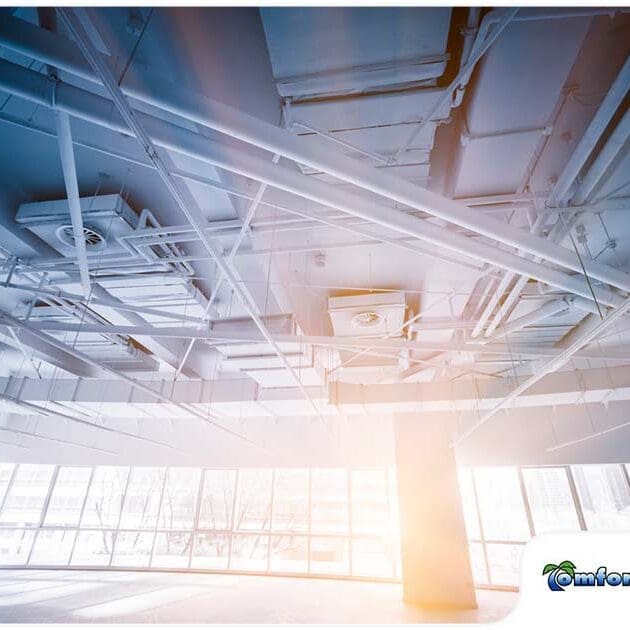 Air conditioners are located in the ceiling of a large commercial room, providing cooling throughout the space