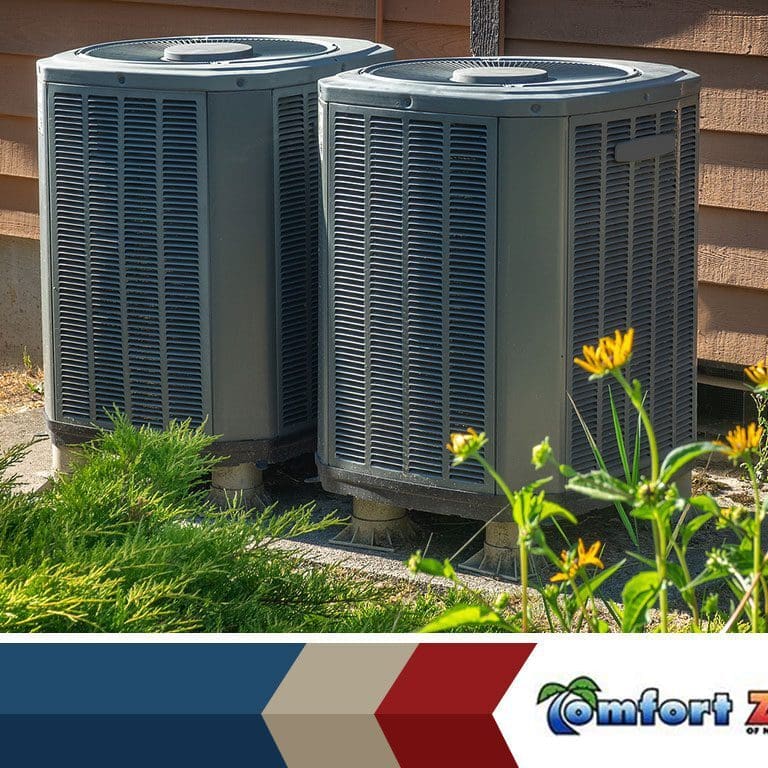 Two air conditioning units are installed outside a house, providing efficient cooling for the home
