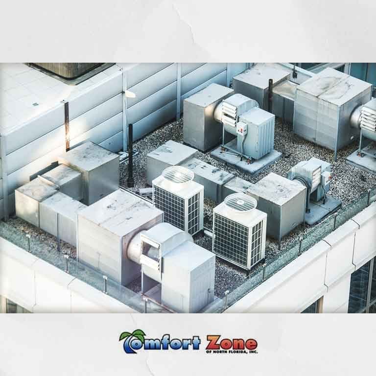 Commercial air conditioners A picture of an industrial building with many air conditioners.