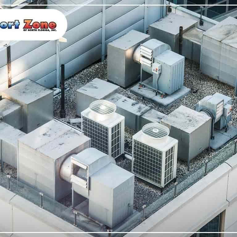 A picture of several air conditioning units installed on top of a building, providing cooling to the structure