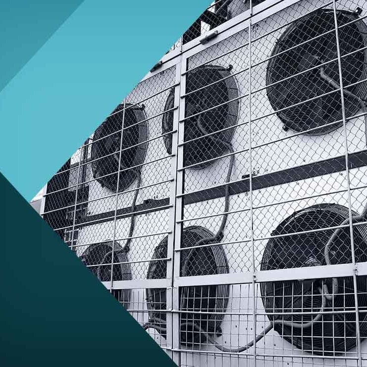 Air Conditioners on the Side of a Building Several air conditioning units are installed on the side of a building, providing cooling for the structure.