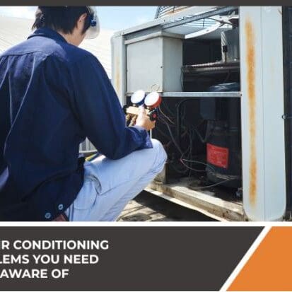An HVAC technician is working on an air conditioning unit, performing maintenance or repairs to ensure efficient operation