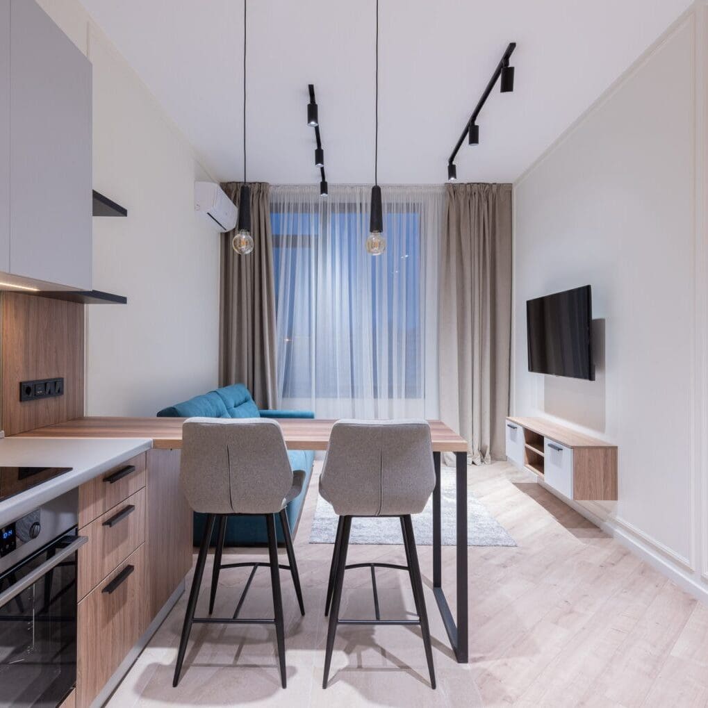 A kitchen featuring a table and chairs, creating a cozy space for dining or socializing